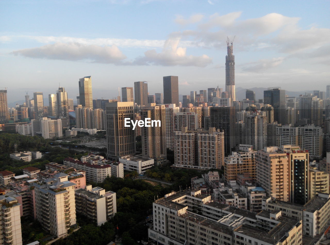 Aerial view of cityscape against sky