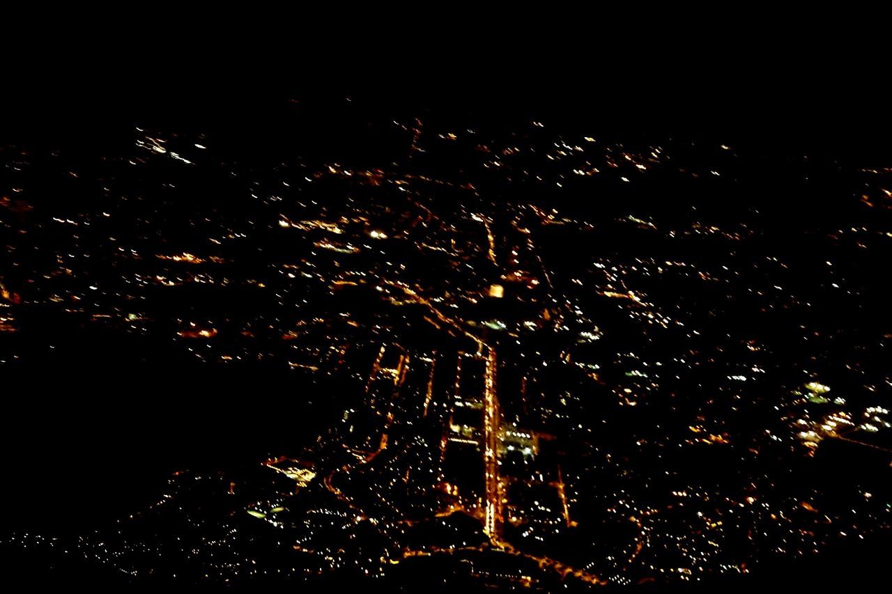 VIEW OF ILLUMINATED CITYSCAPE AT NIGHT