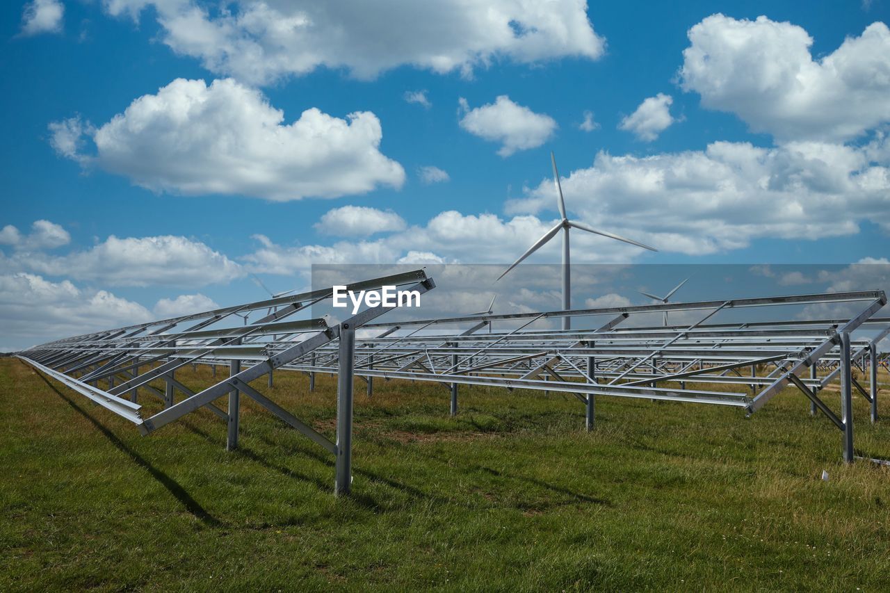 METALLIC STRUCTURE ON LAND AGAINST SKY