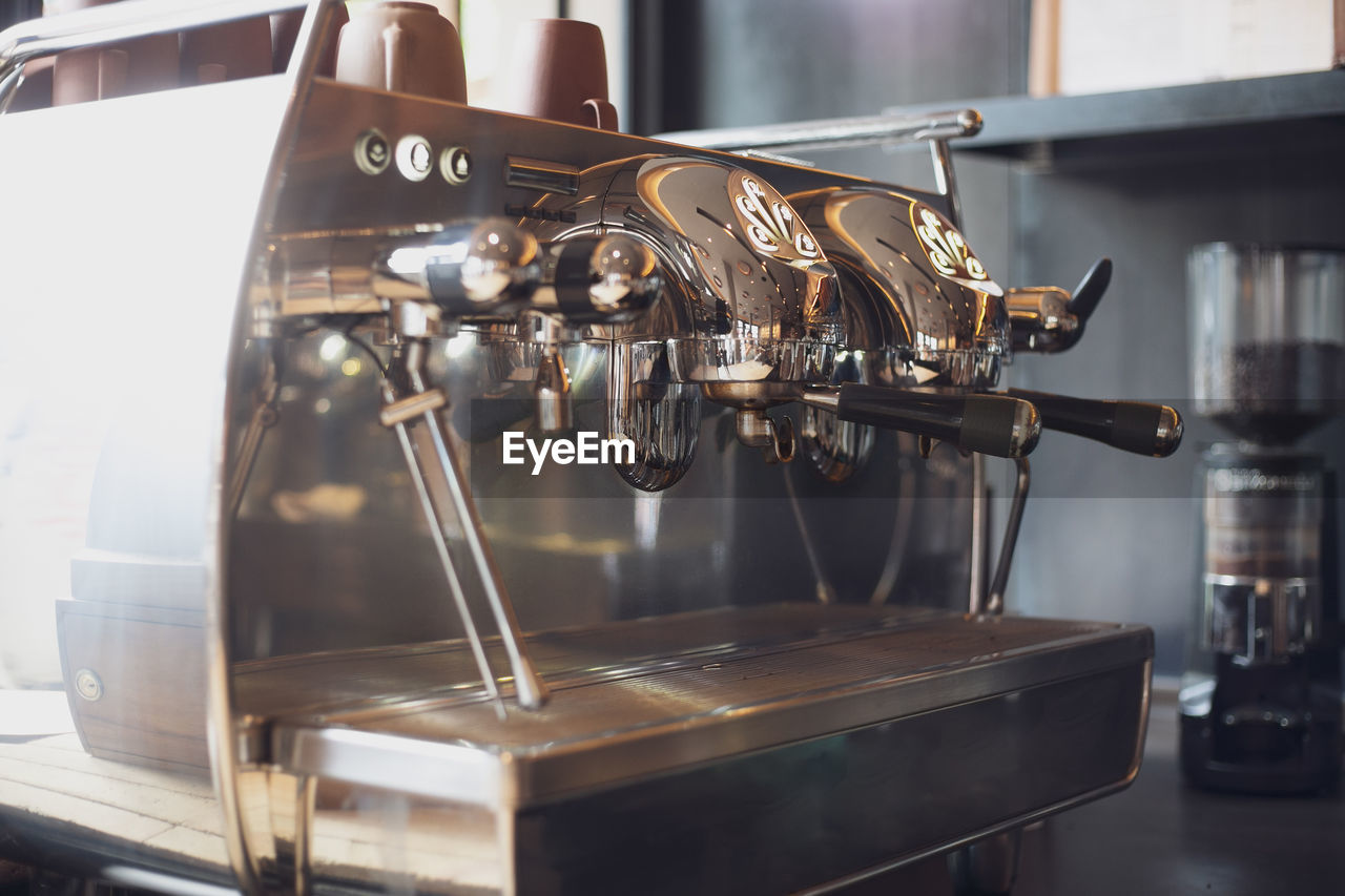 CLOSE-UP OF COFFEE WITH MACHINE