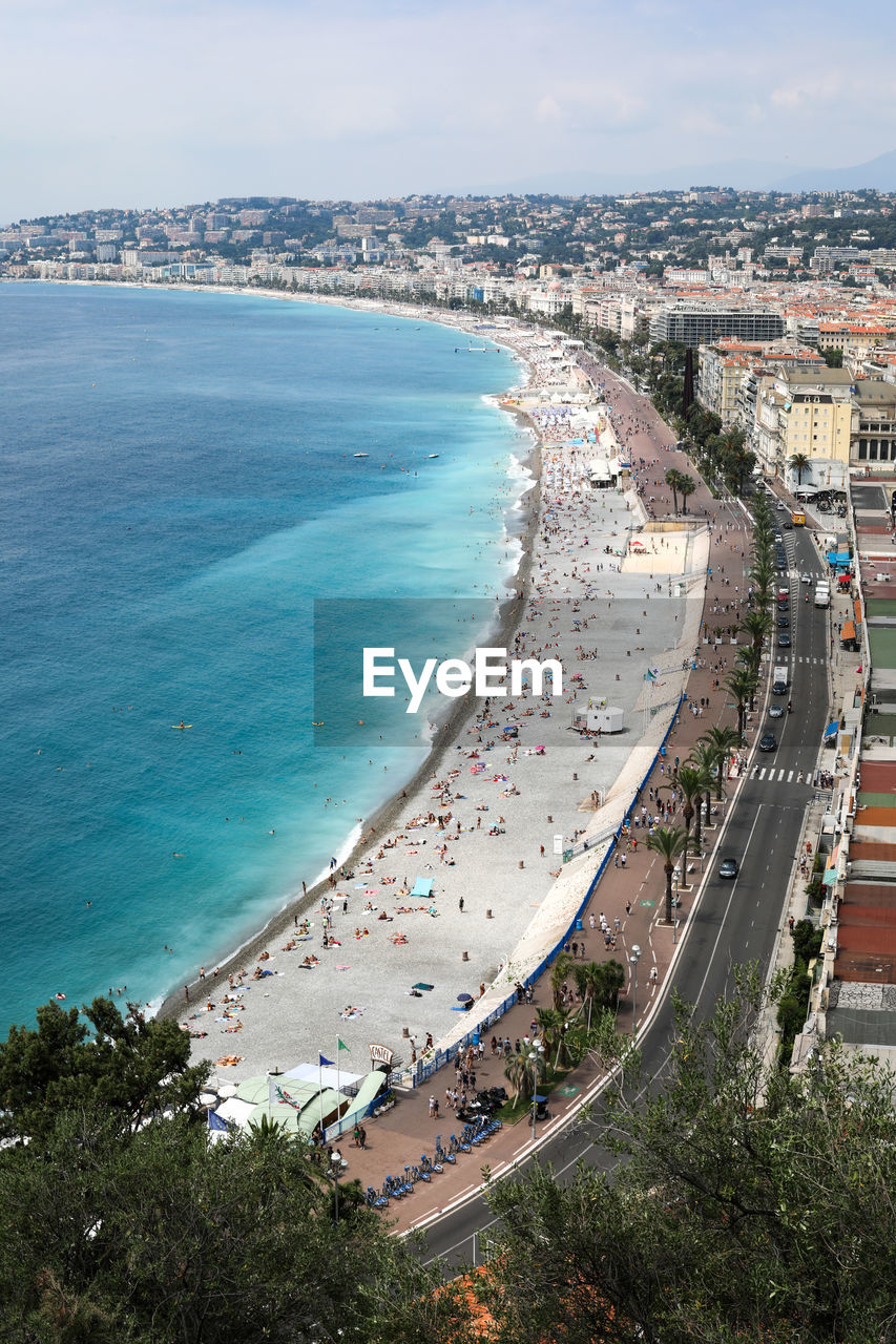 High angle view of sea and buildings against sky