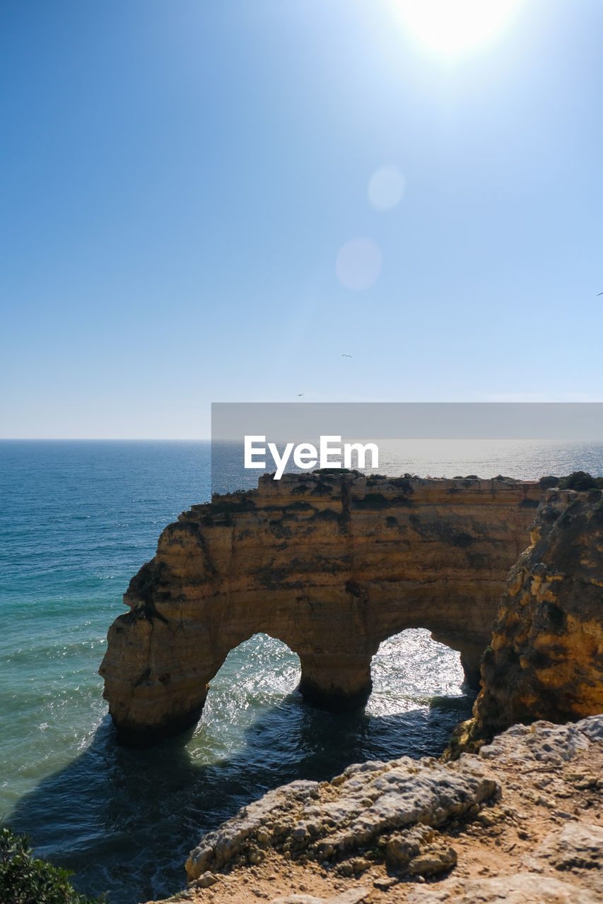 Scenic view of two natural archs clear blue sky