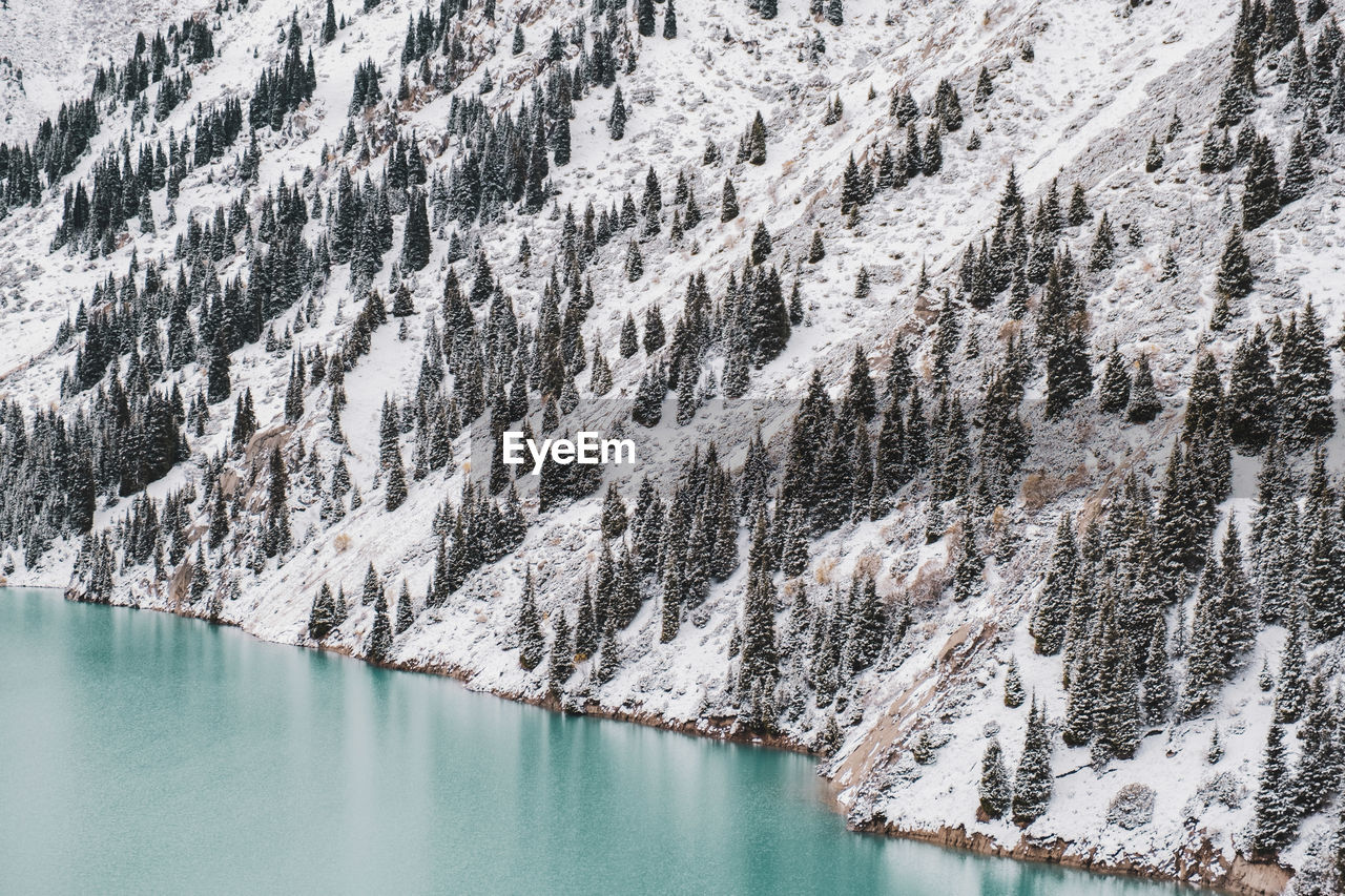 Panoramic view of lake and mountains during winter