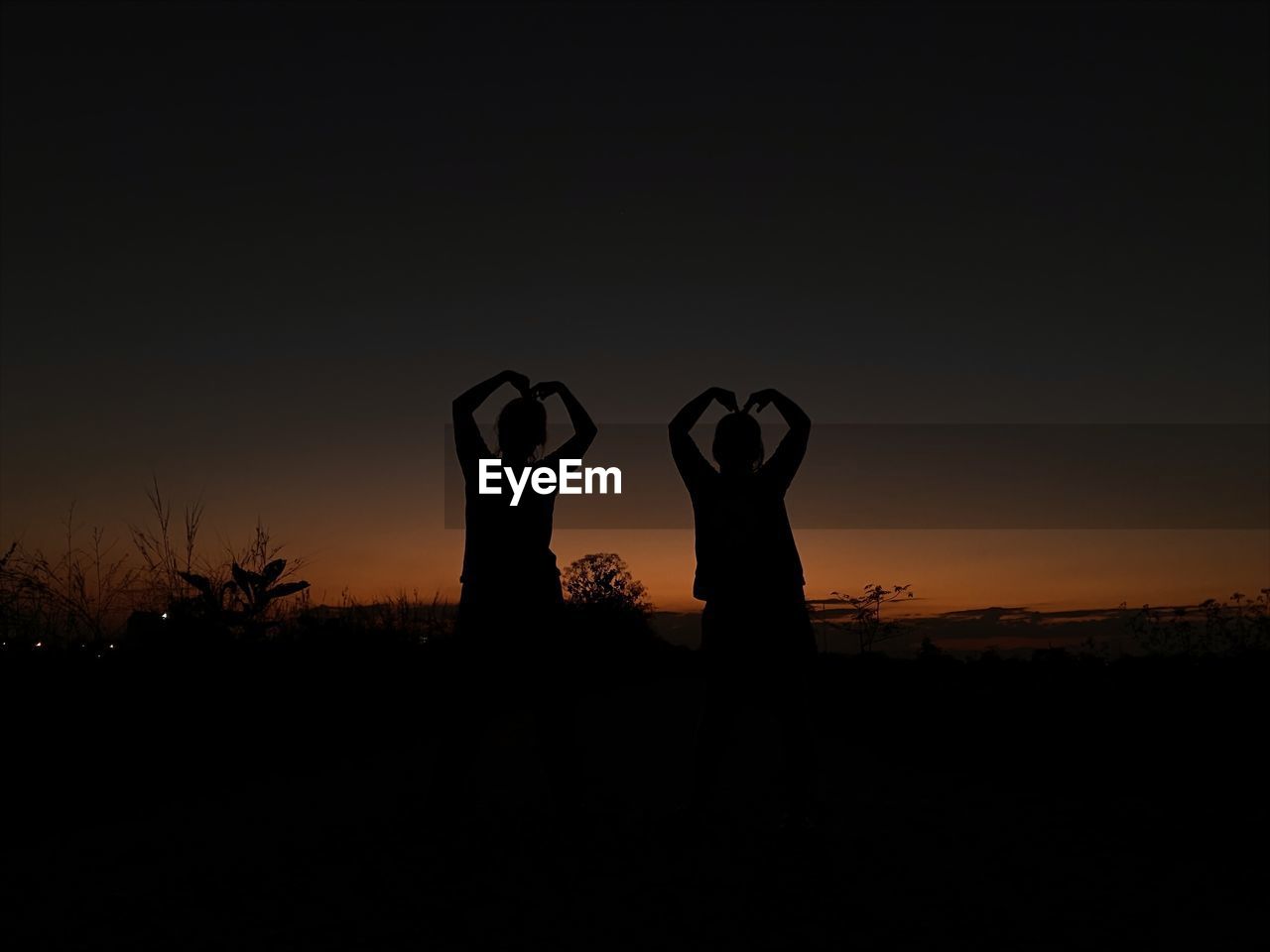 silhouette, darkness, sky, sunset, horizon, nature, copy space, emotion, evening, dusk, night, positive emotion, two people, love, outdoors, adult, landscape, land, togetherness