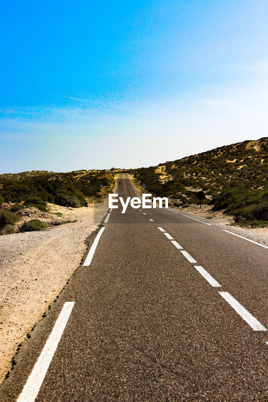 Empty road along landscape