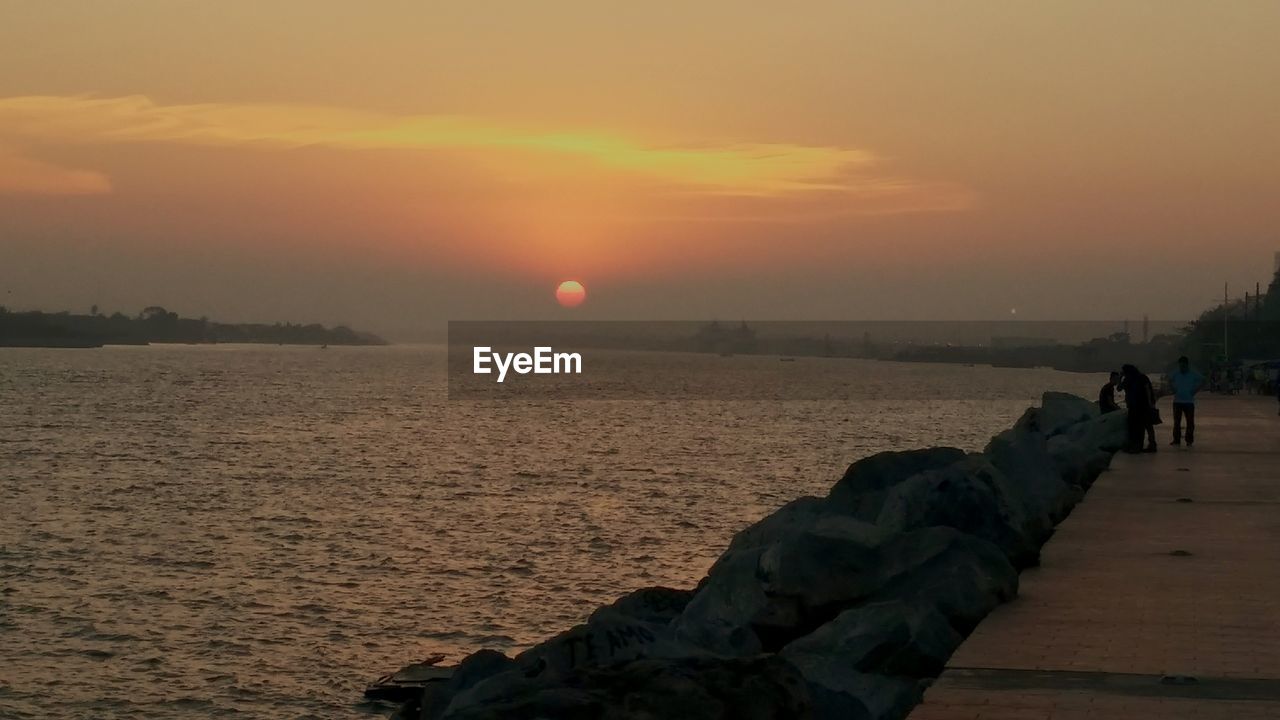 SCENIC VIEW OF SEA DURING SUNSET