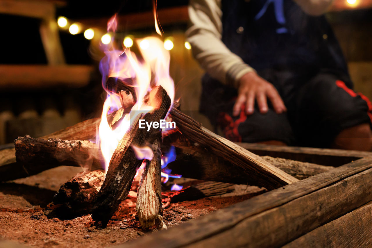 heat, burning, fire, flame, adult, wood, one person, food and drink, nature, men, food, night, bonfire, selective focus, log, motion, campfire, glowing