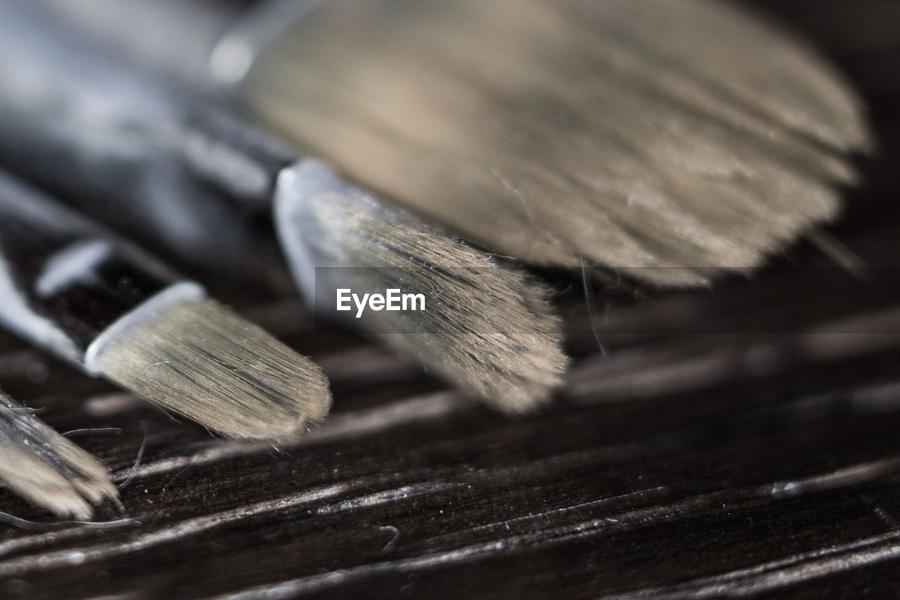 Close-up of paintbrushes on table