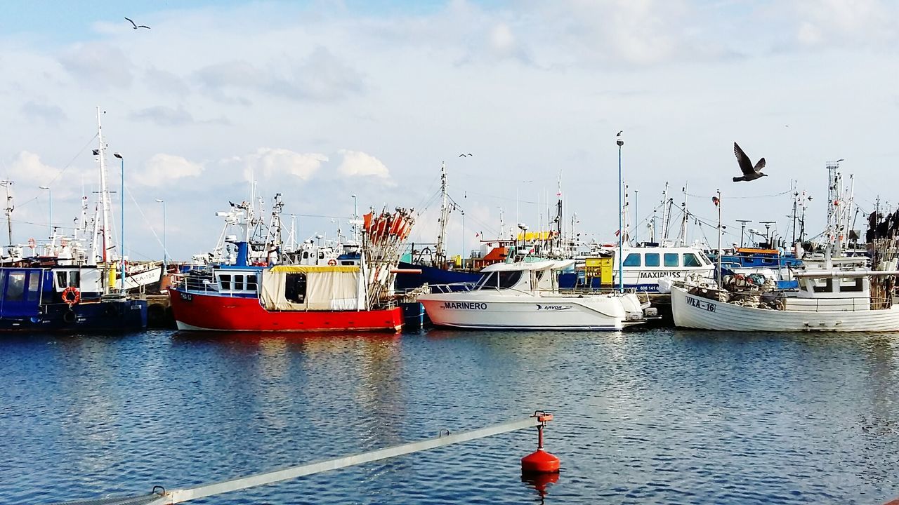 Boats moored at harbor