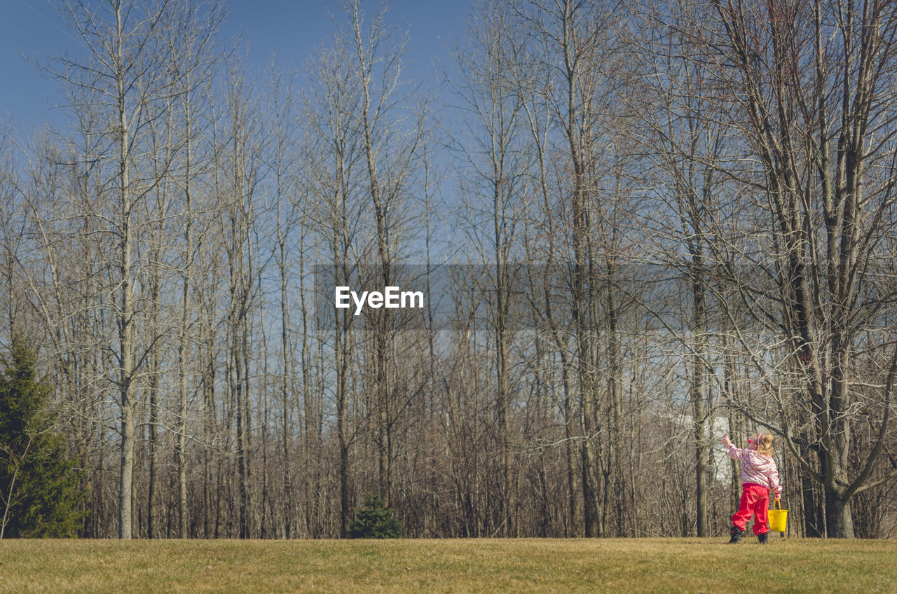 Full length of girl playing outdoors