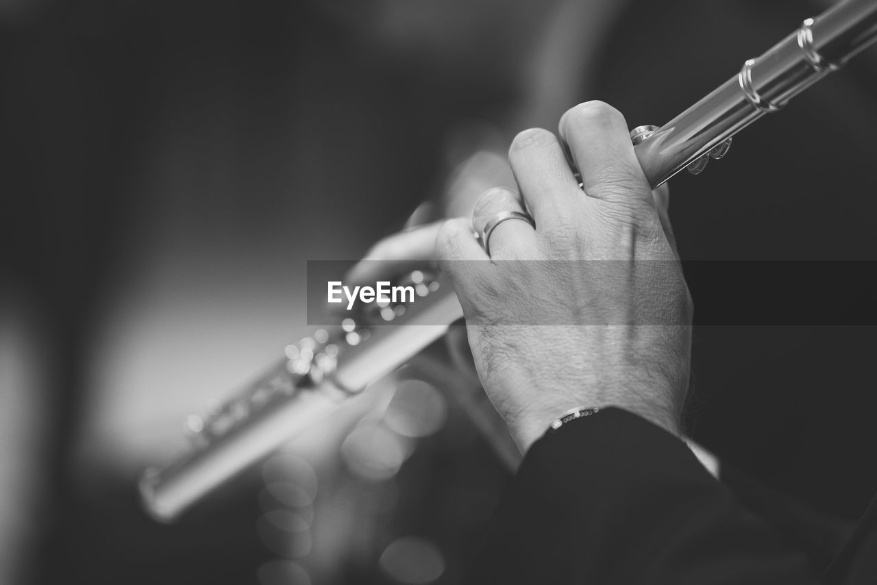 Cropped image of man playing clarinet