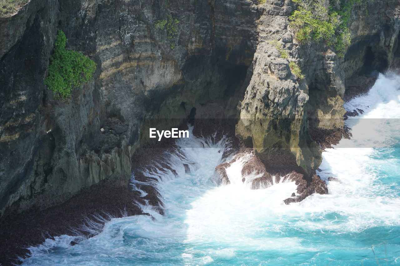 WATER SPLASHING ON ROCK