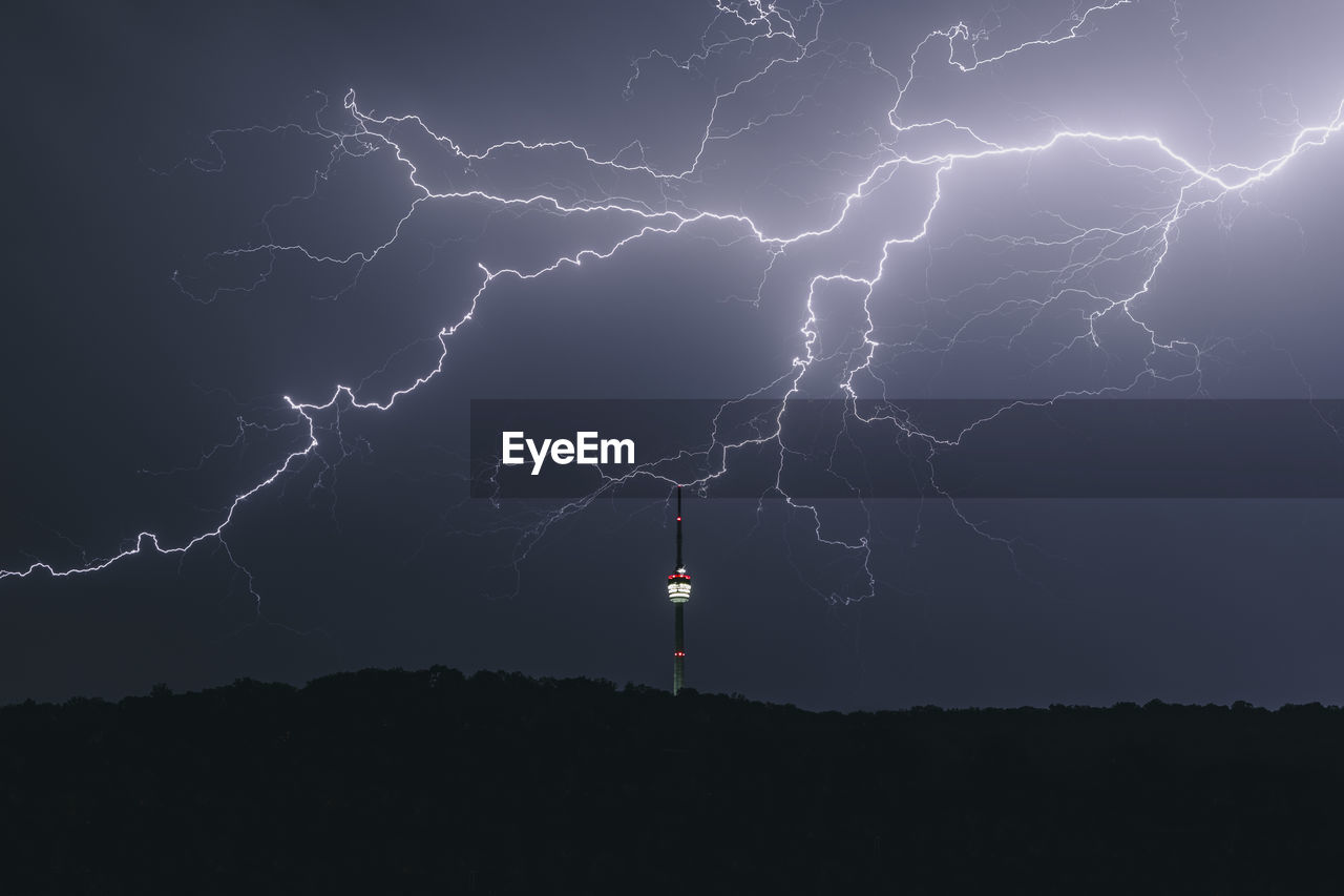 Tv tower at night during a thunderstorm id 159900818