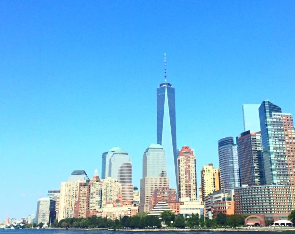 LOW ANGLE VIEW OF SKYSCRAPERS AGAINST CLEAR SKY