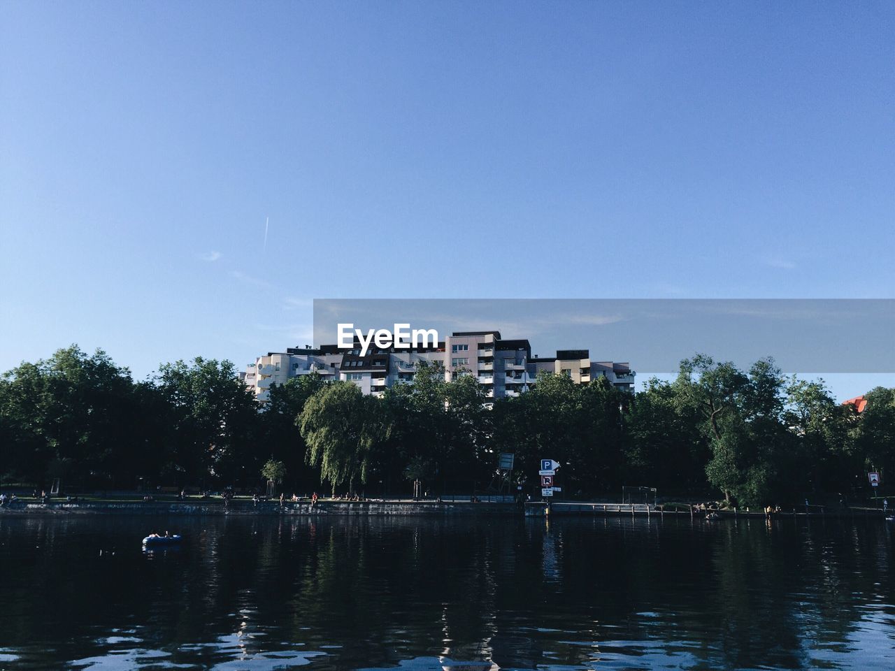 SCENIC VIEW OF CALM RIVER AGAINST CLEAR SKY