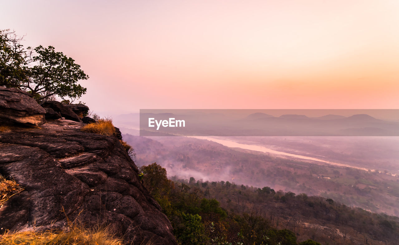 Scenic view of mountains against sky during sunset