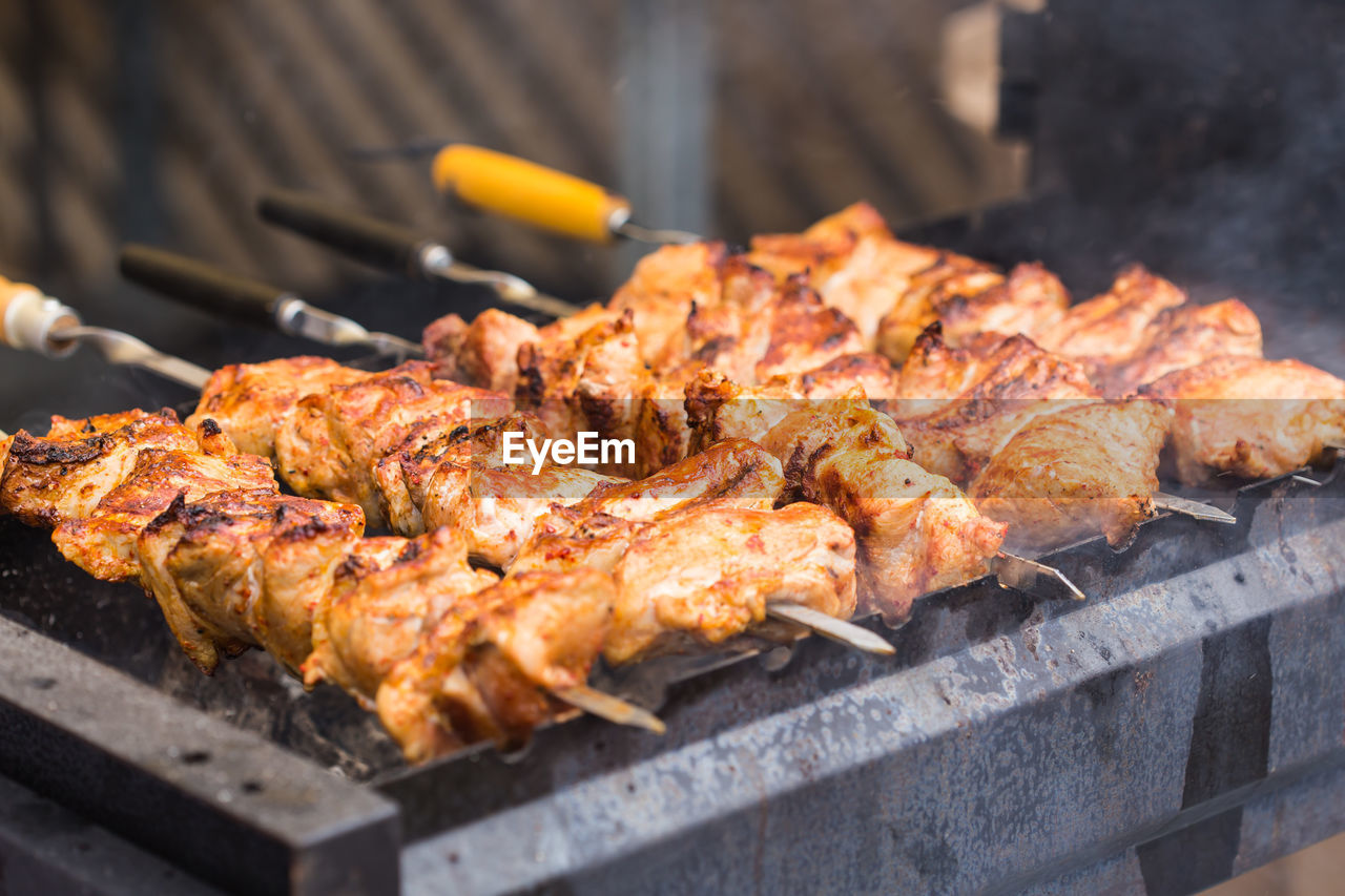 HIGH ANGLE VIEW OF MEAT ON BARBECUE