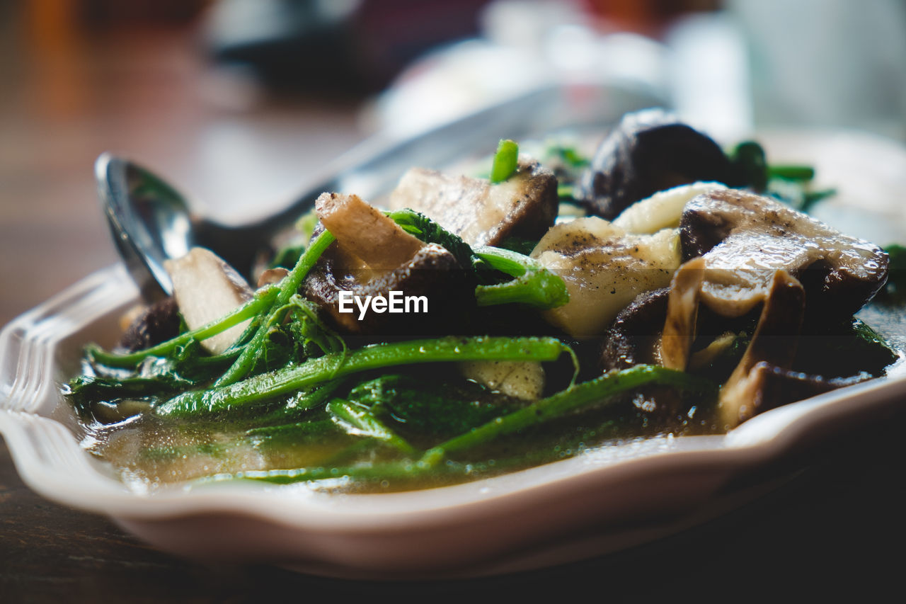 Close-up of food in bowl with spoon on table