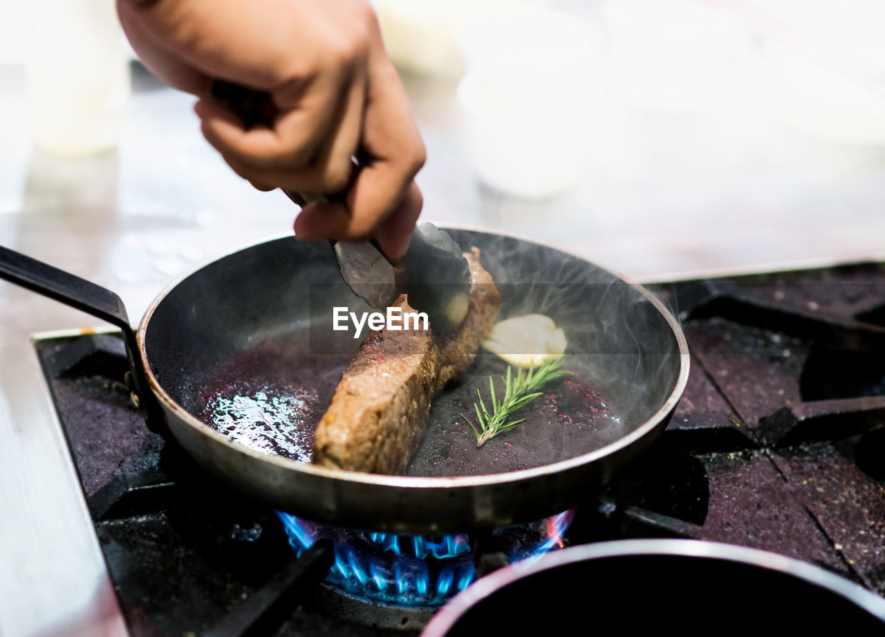 cropped hand of person preparing food