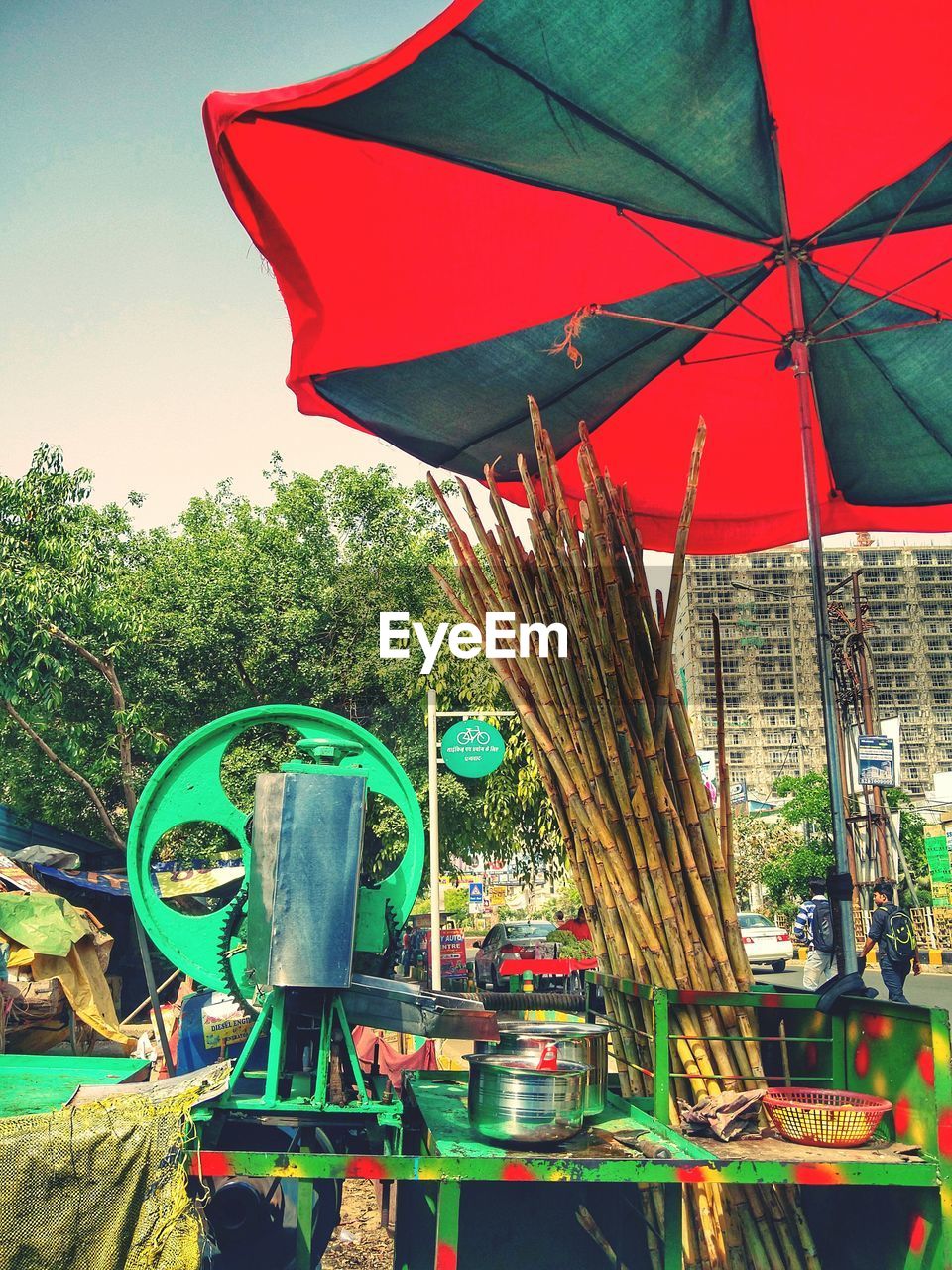 LOW ANGLE VIEW OF MULTI COLORED UMBRELLAS