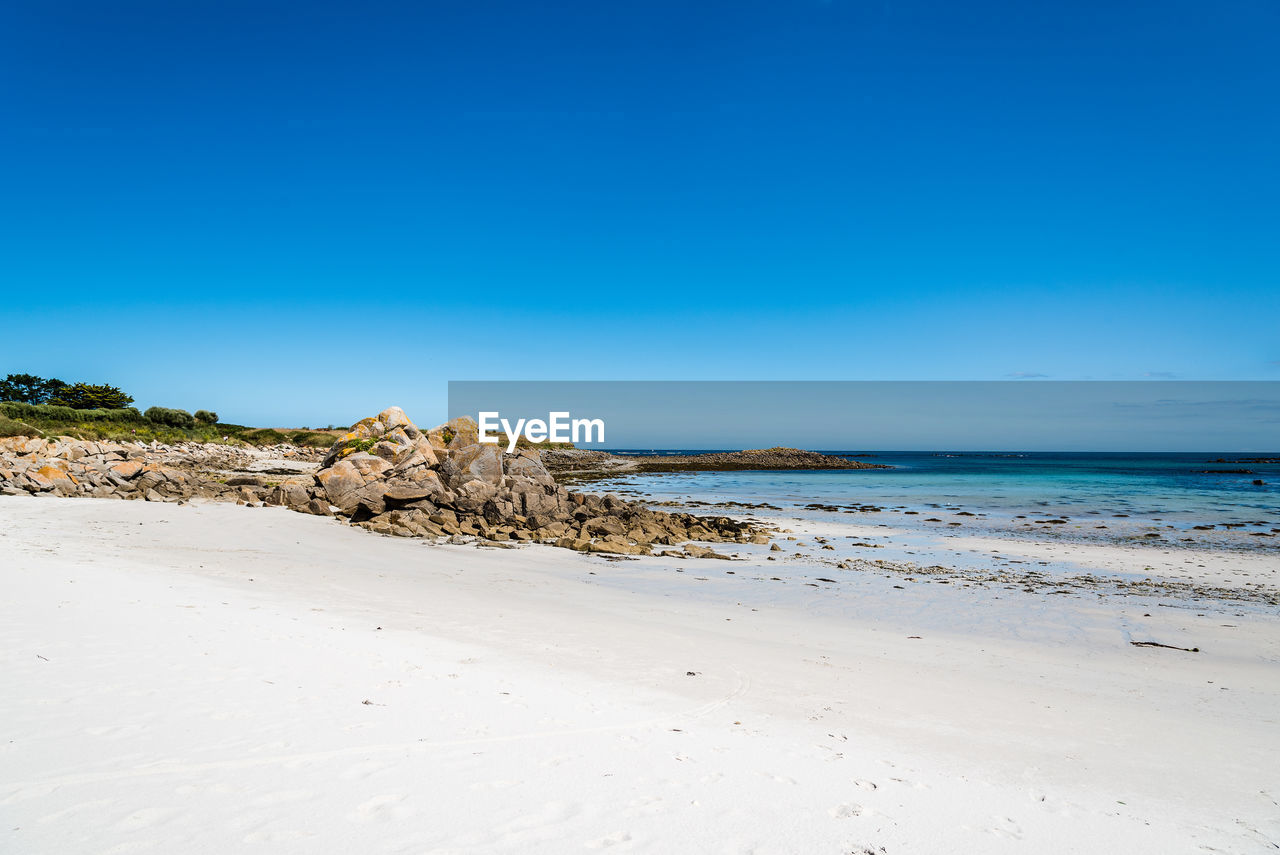 Scenic view of beach in the island of batz a sunny day of summer