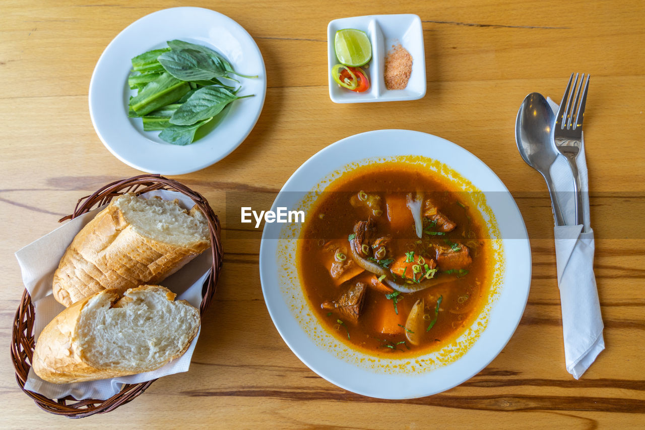 Vietnamese traditional cuisine, braised beef with bread - bo kho