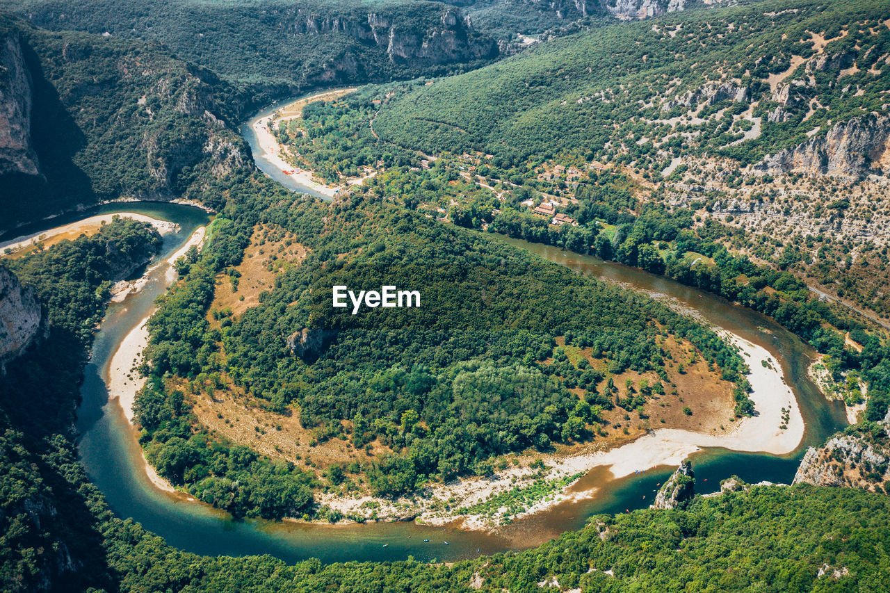 Aerial view of river flowing on landscape