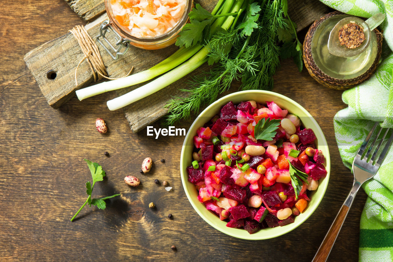 Beetroot salad vinaigrette with sauerkraut, pickled cucumber and vegetables. 