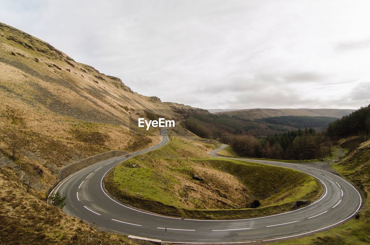 Scenic view of mountain road against sky