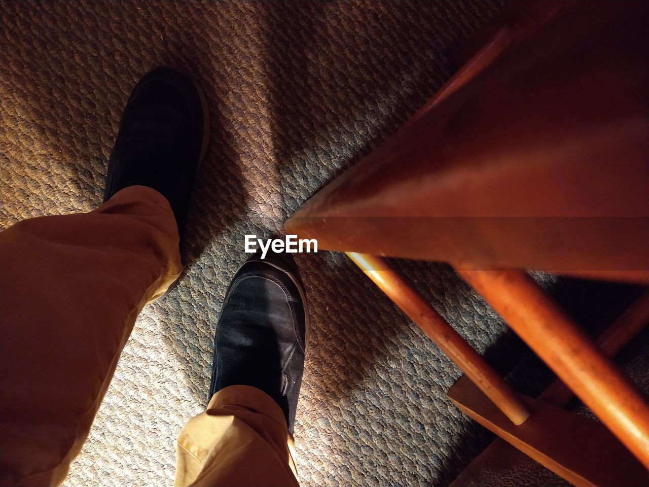 shoe, low section, human leg, footwear, one person, personal perspective, limb, human limb, brown, high angle view, lifestyles, men, adult, close-up, light, human foot, standing, black, wood, indoors