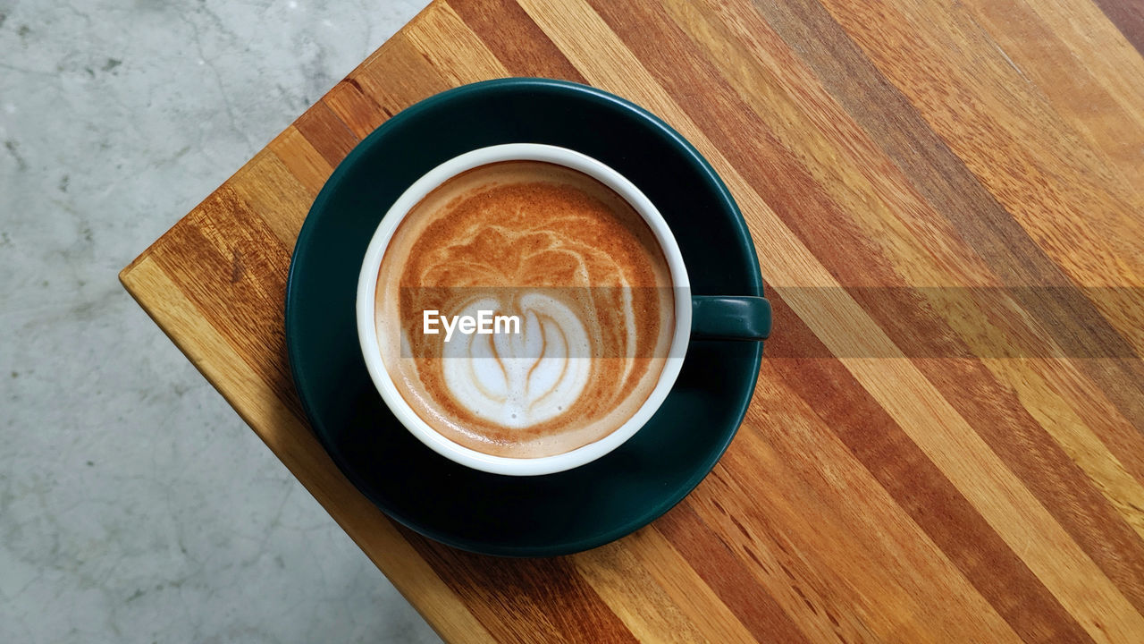 High angle view of cappuccino on table