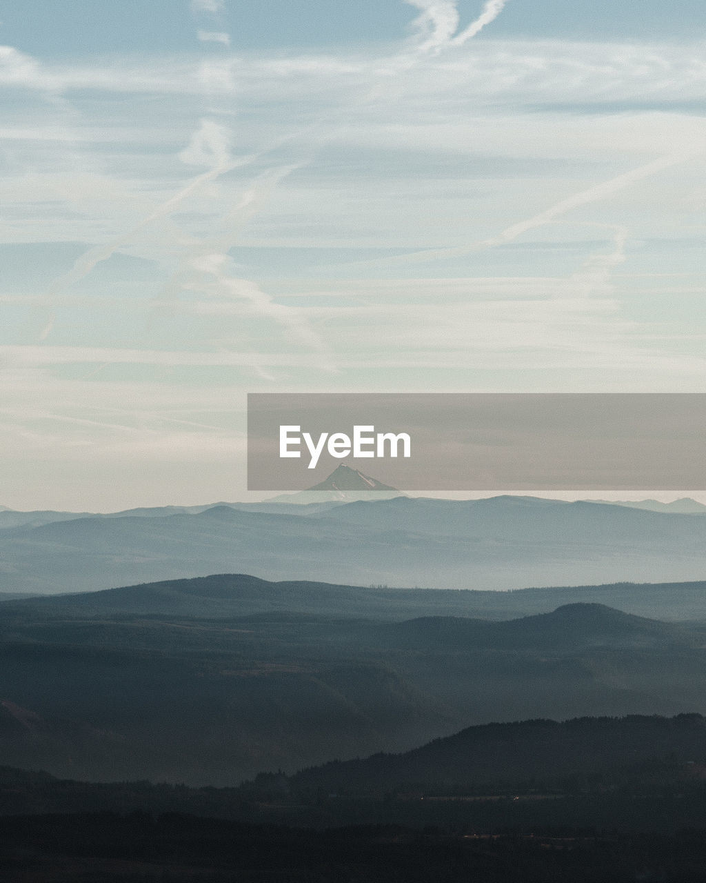 Scenic view of silhouette mountains against sky