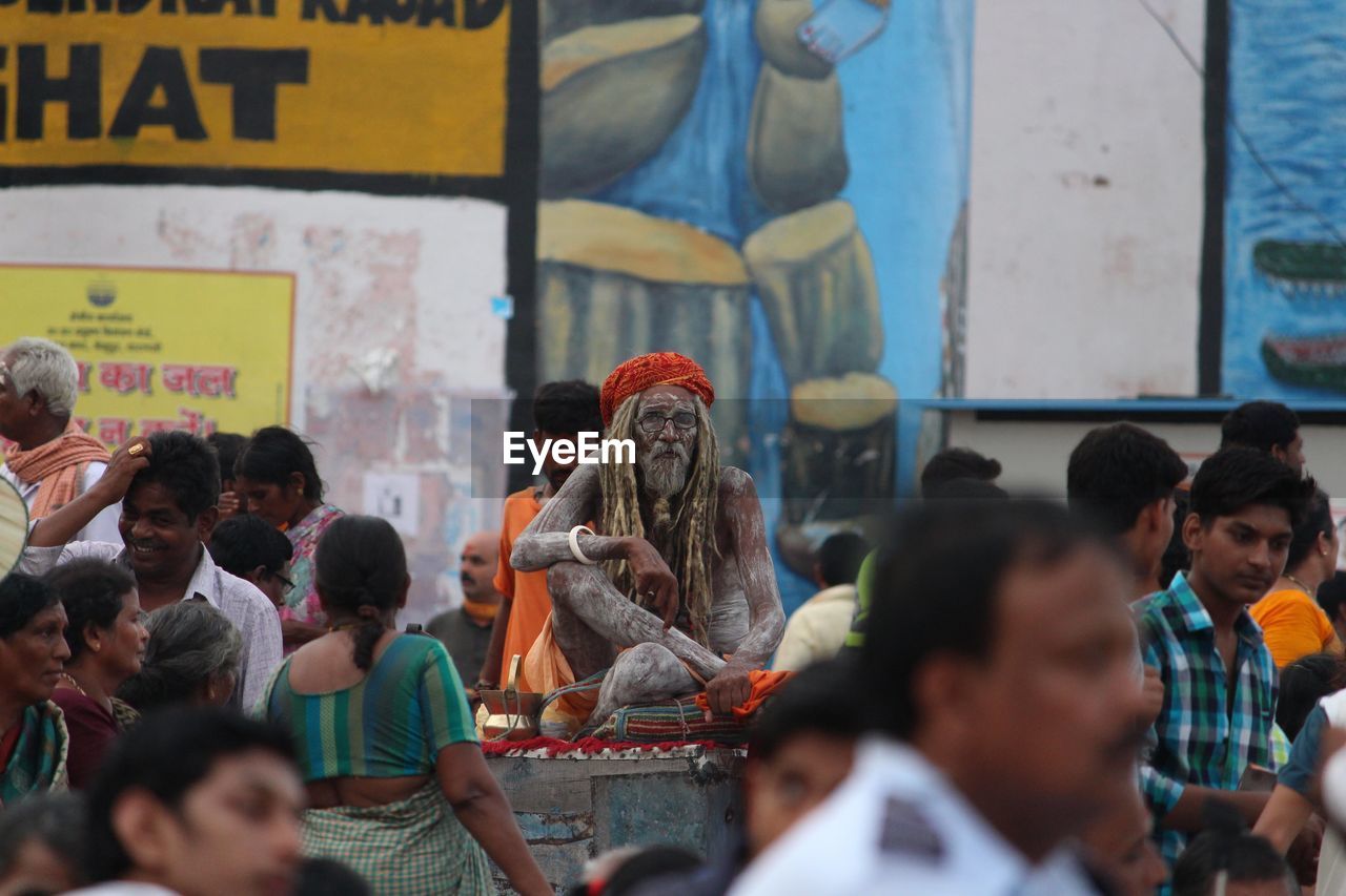 PEOPLE LOOKING AT MARKET IN CITY