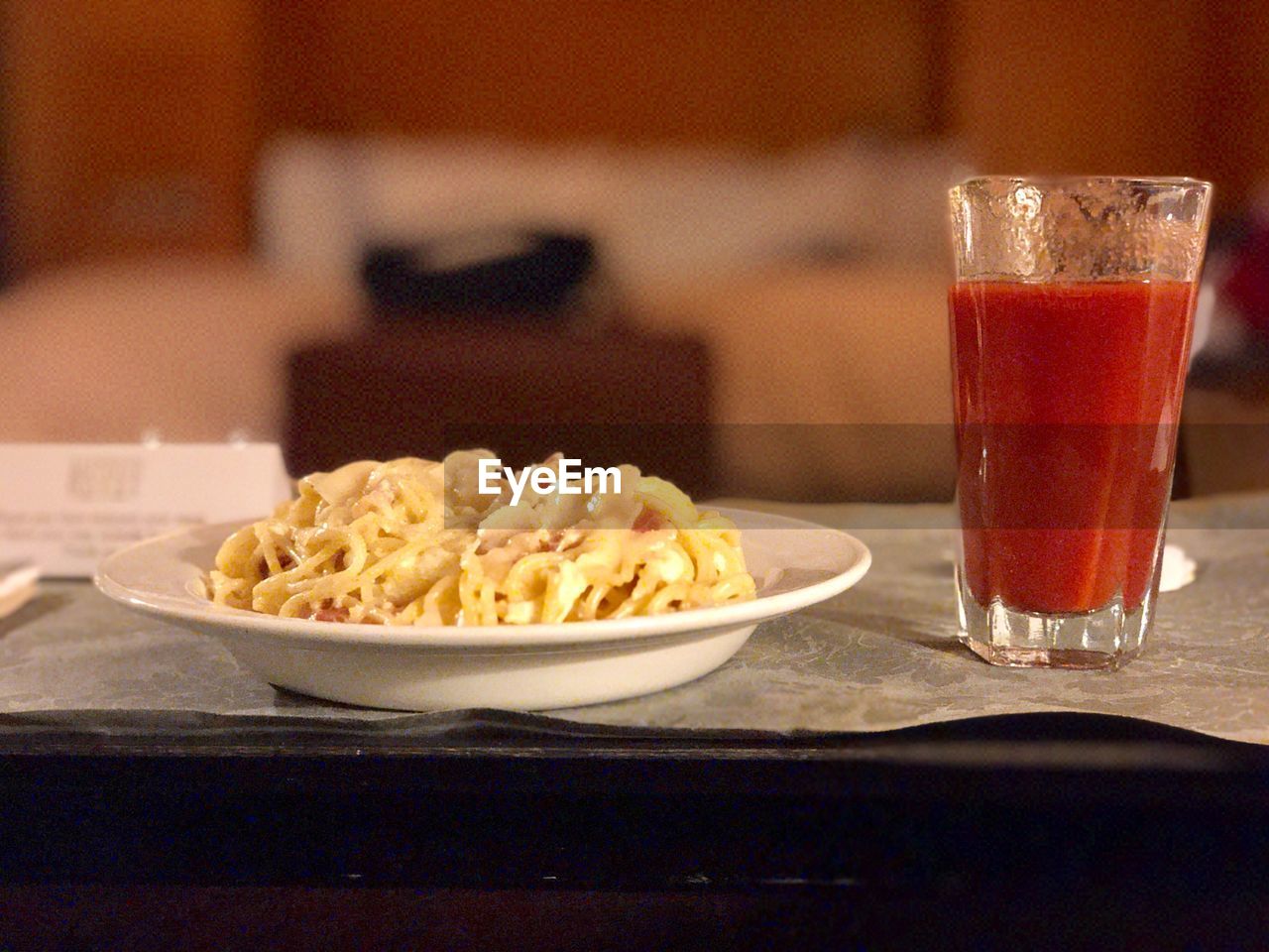 CLOSE-UP OF DRINK WITH ICE CREAM IN GLASS ON TABLE