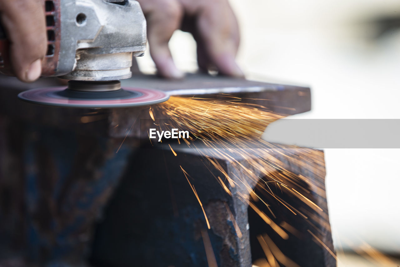 Close-up of person working in factory