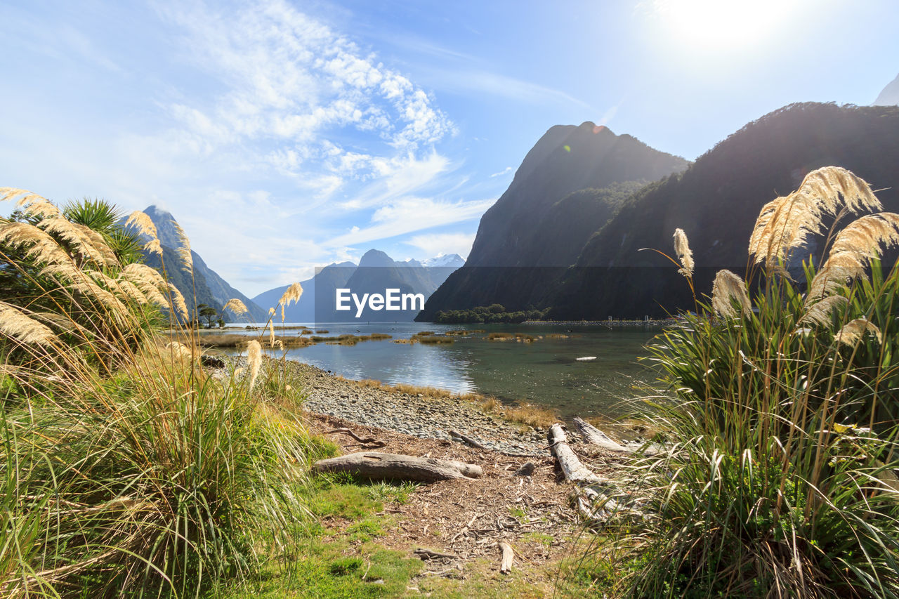 Scenic view of lake with mountain range in background