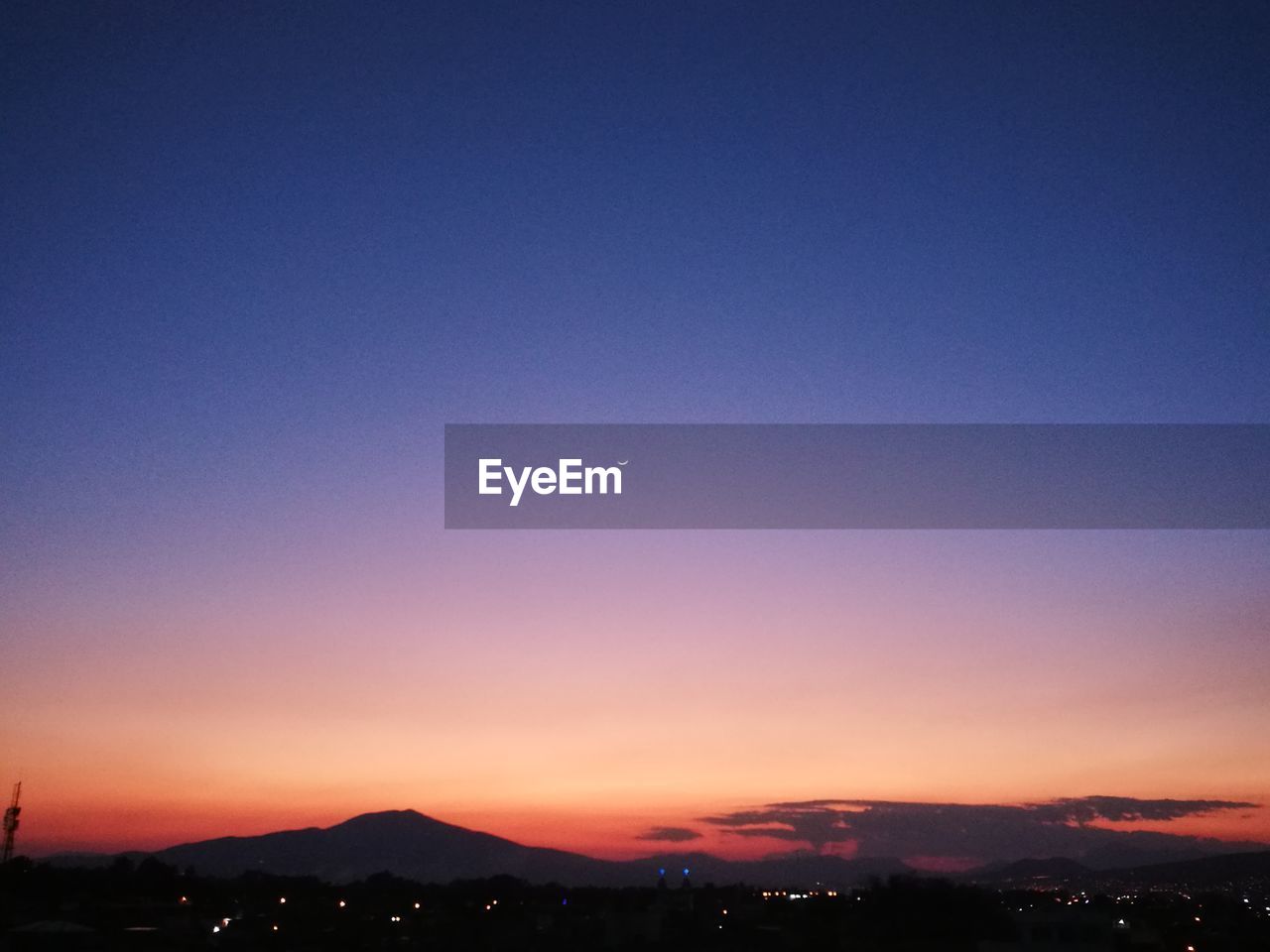 SILHOUETTE LANDSCAPE AGAINST CLEAR SKY AT NIGHT