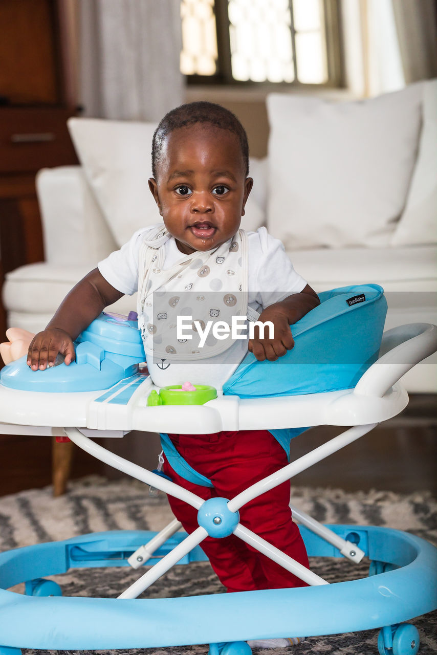 Portrait of cute baby boy sitting