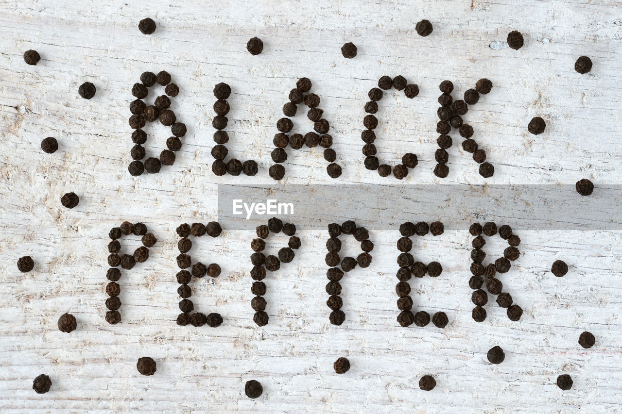 Directly above shot of black pepper text on table