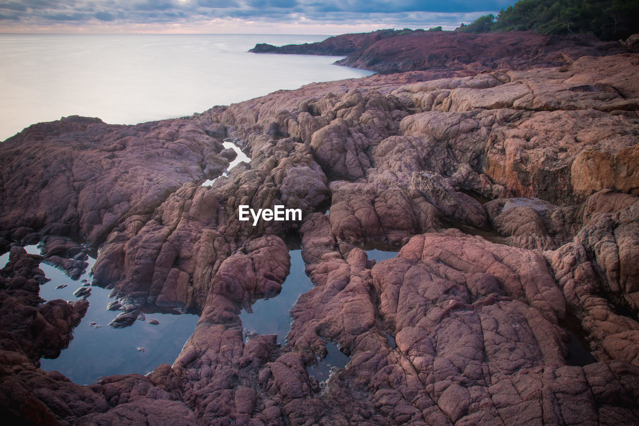 Scenic view of rock formations against sky