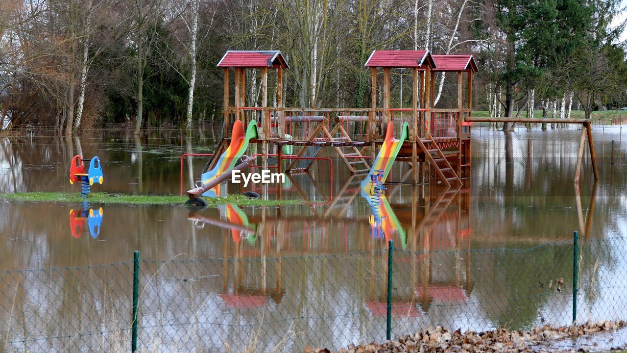 water, tree, plant, nature, reflection, day, lake, no people, outdoors, built structure, architecture, playground, tranquility