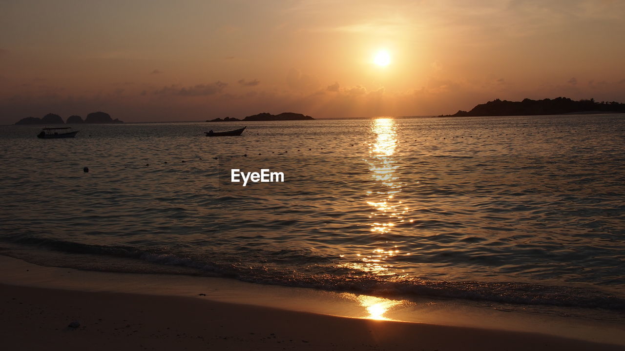 SCENIC VIEW OF SEA DURING SUNSET