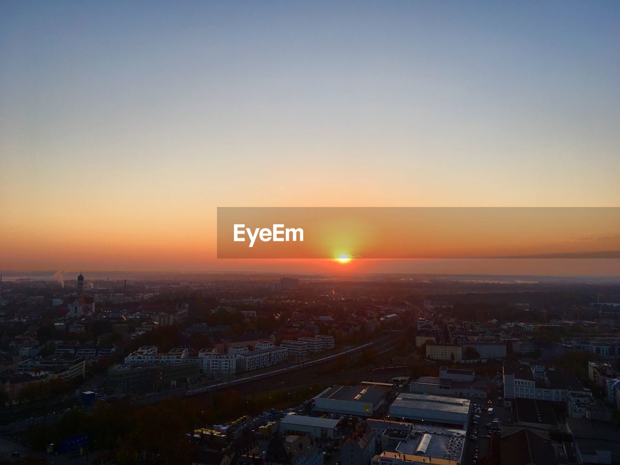 High angle view of buildings against sky during sunset