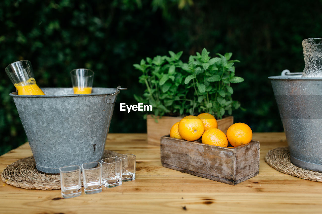 Close-up of drink in metallic bucket on table