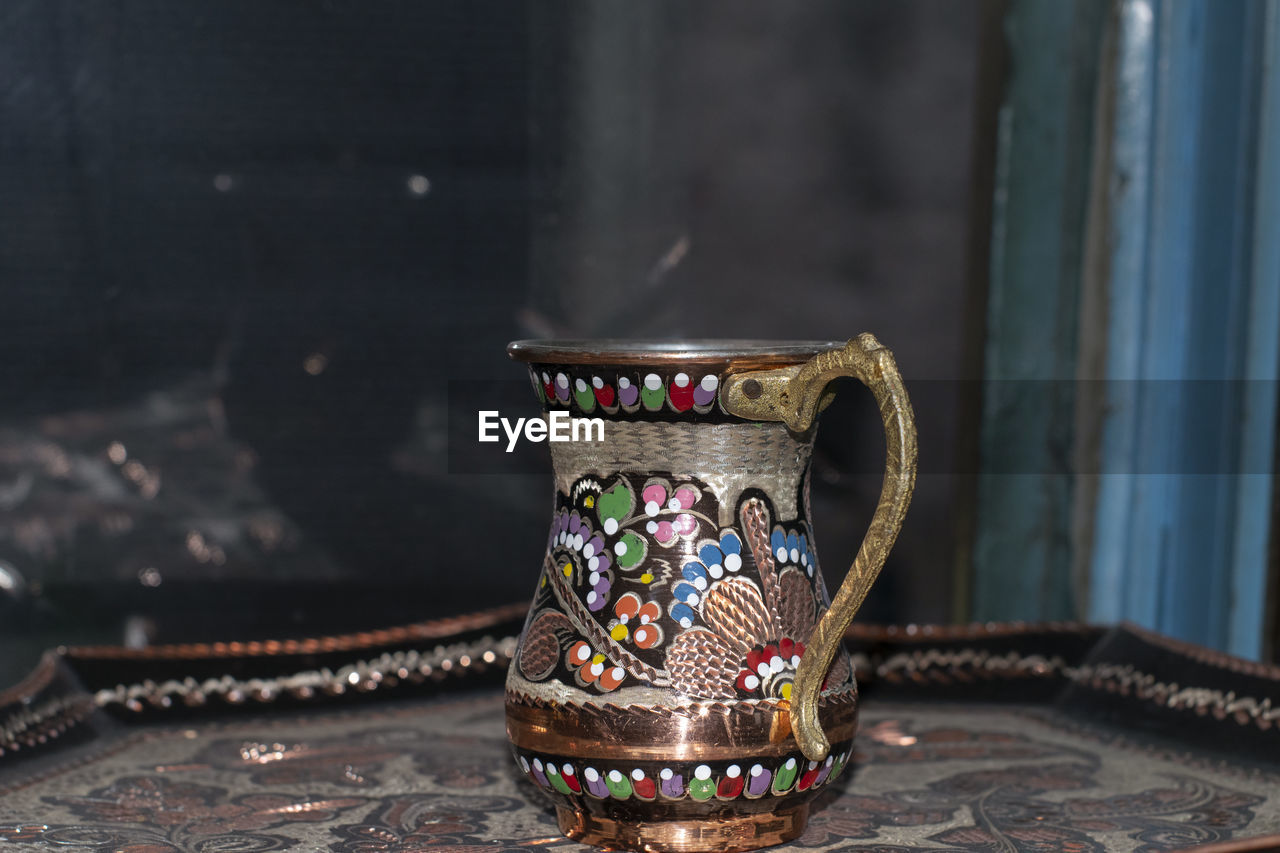 Close-up of antique container at market stall