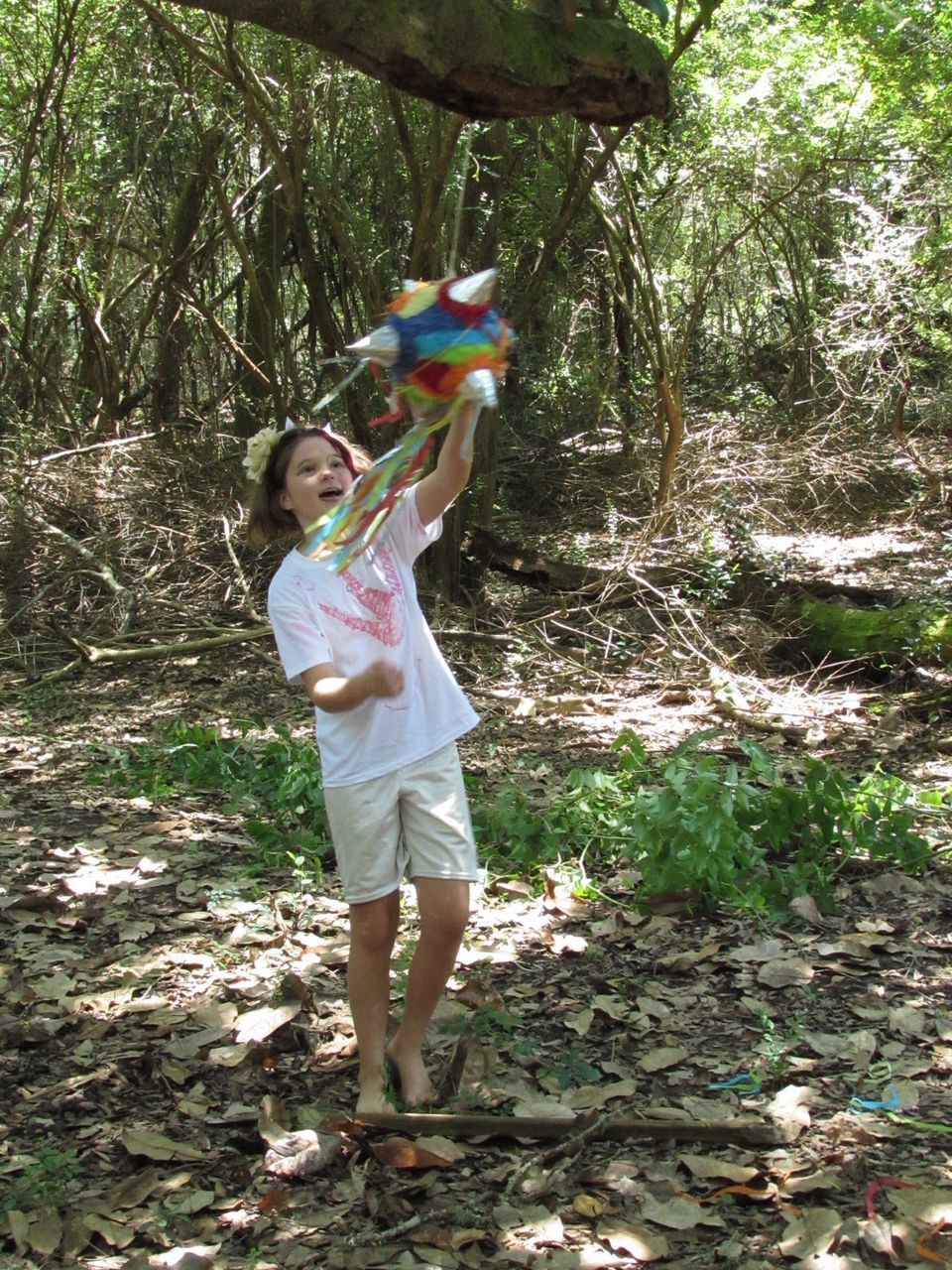 WOMAN STANDING IN FOREST