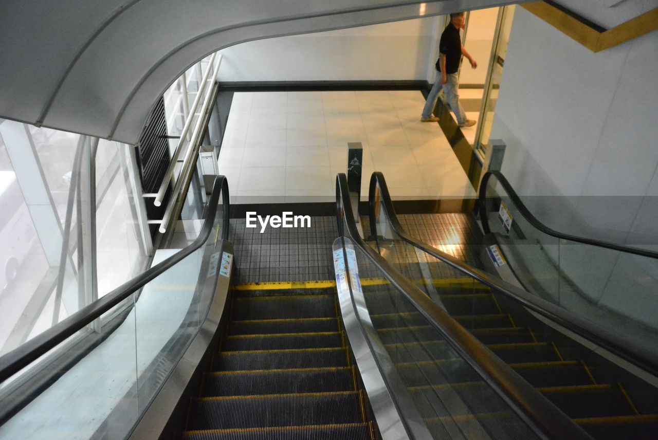 HIGH ANGLE VIEW OF ESCALATOR AT SUBWAY