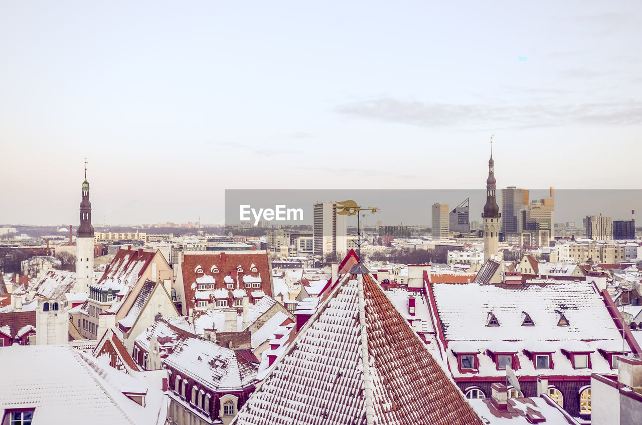 High angle view of city buildings against sky