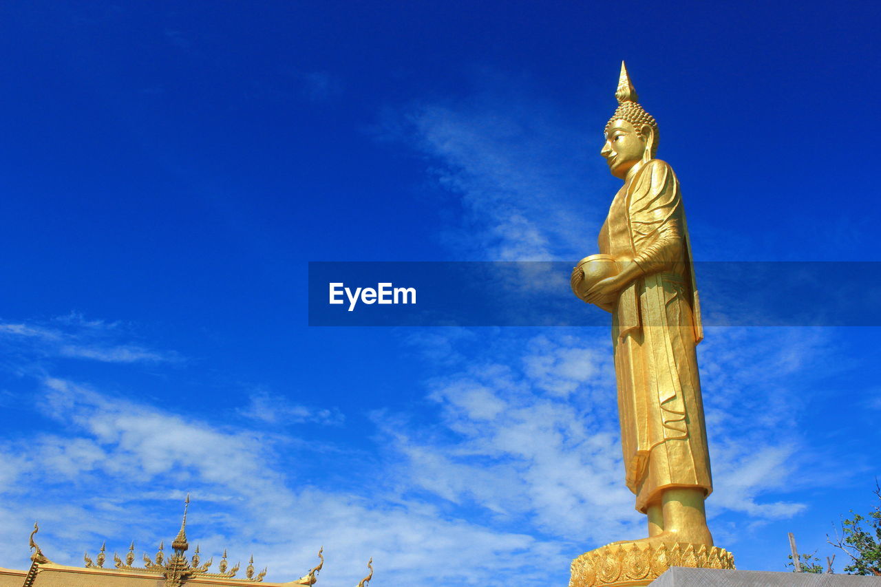 LOW ANGLE VIEW OF BUILT STRUCTURES AGAINST BLUE SKY