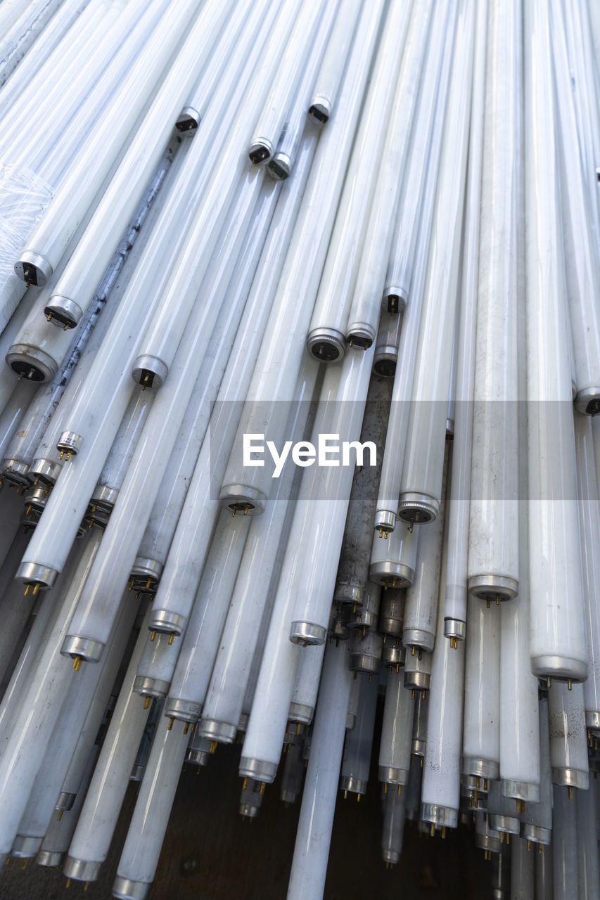 LOW ANGLE VIEW OF PIPES ON WALL IN FACTORY